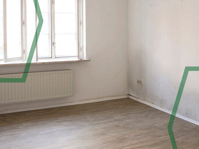 An image of a room with rising damp on the walls