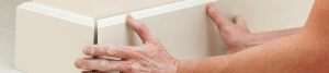 An image showing new skirting boards being installed into a property.